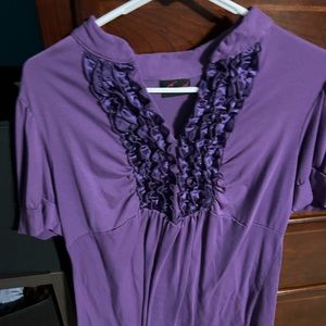 Last Chance Donating next week. Ruffle short sleeve purple shirt. Stretchy